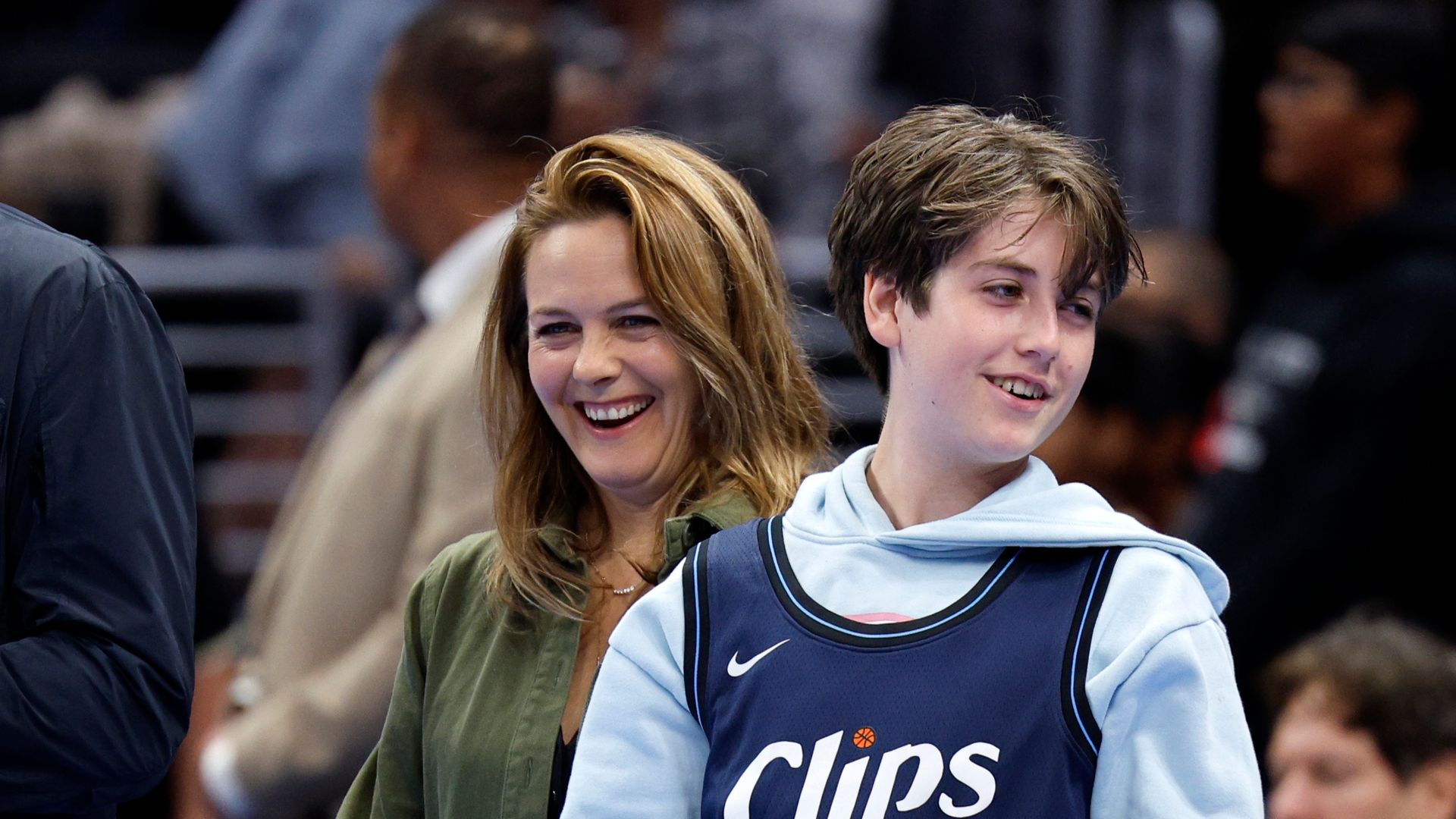 Alicia Silverstone's son Bear, 12, towers over her while spending