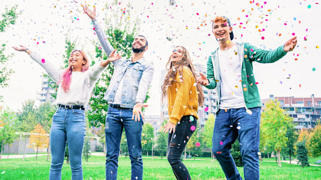 students celebrating with confetti 