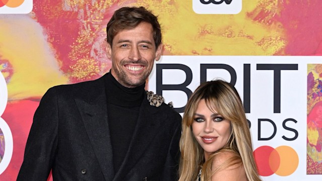 couple posing at brit awards 