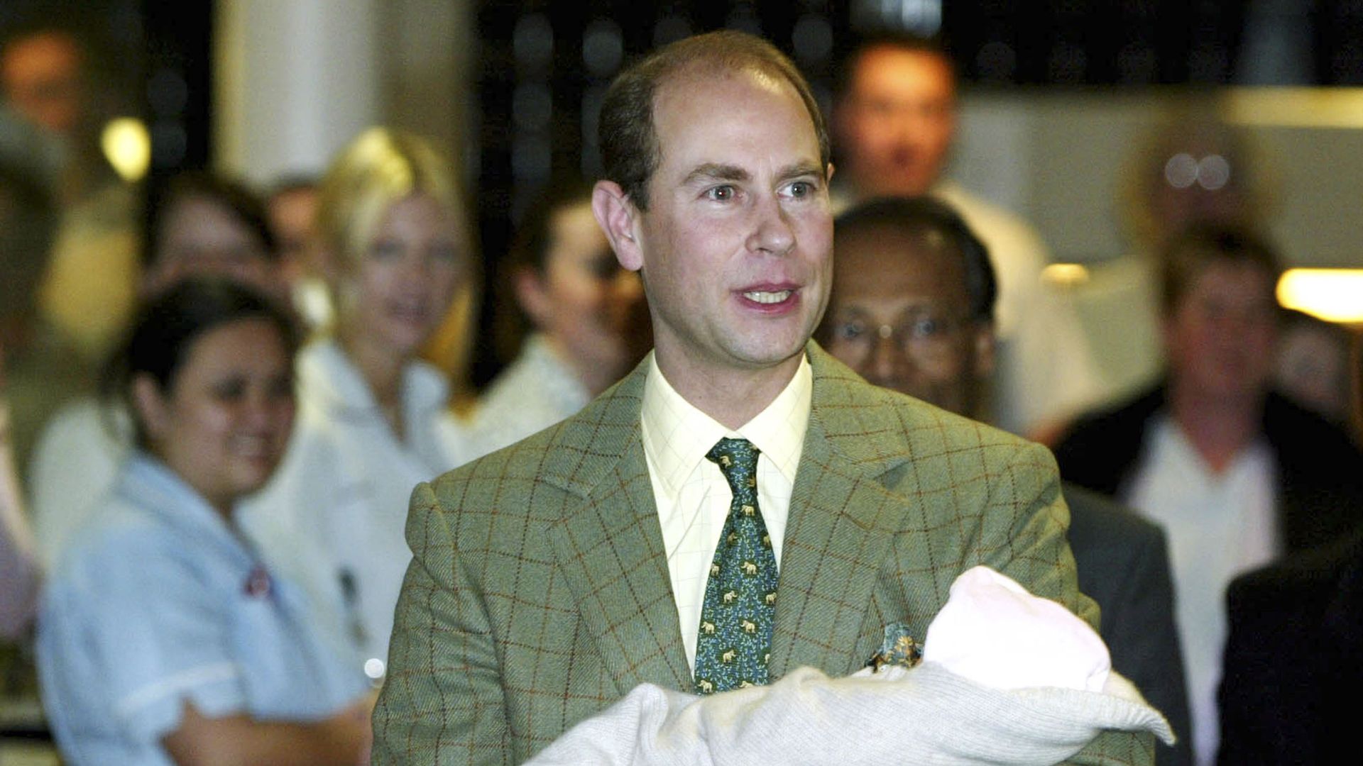 Prince Edward carrying a baby Lady Louise Windsor
