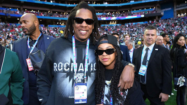 Jay Z and Kelly Rowland together wearing sunglasses