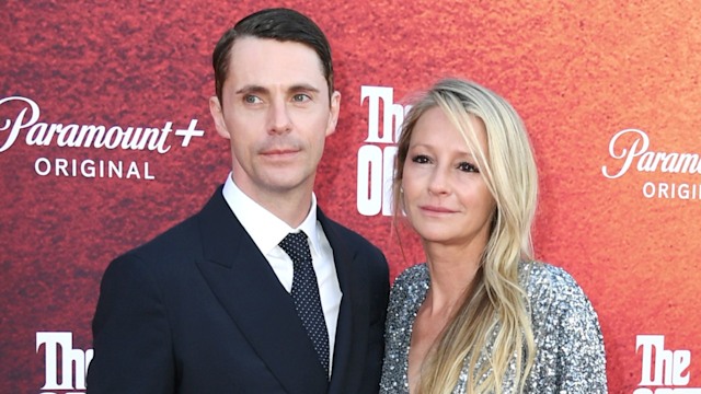 Matthew Goode and Sophie Dymoke on red carpet of premiere posing for photos