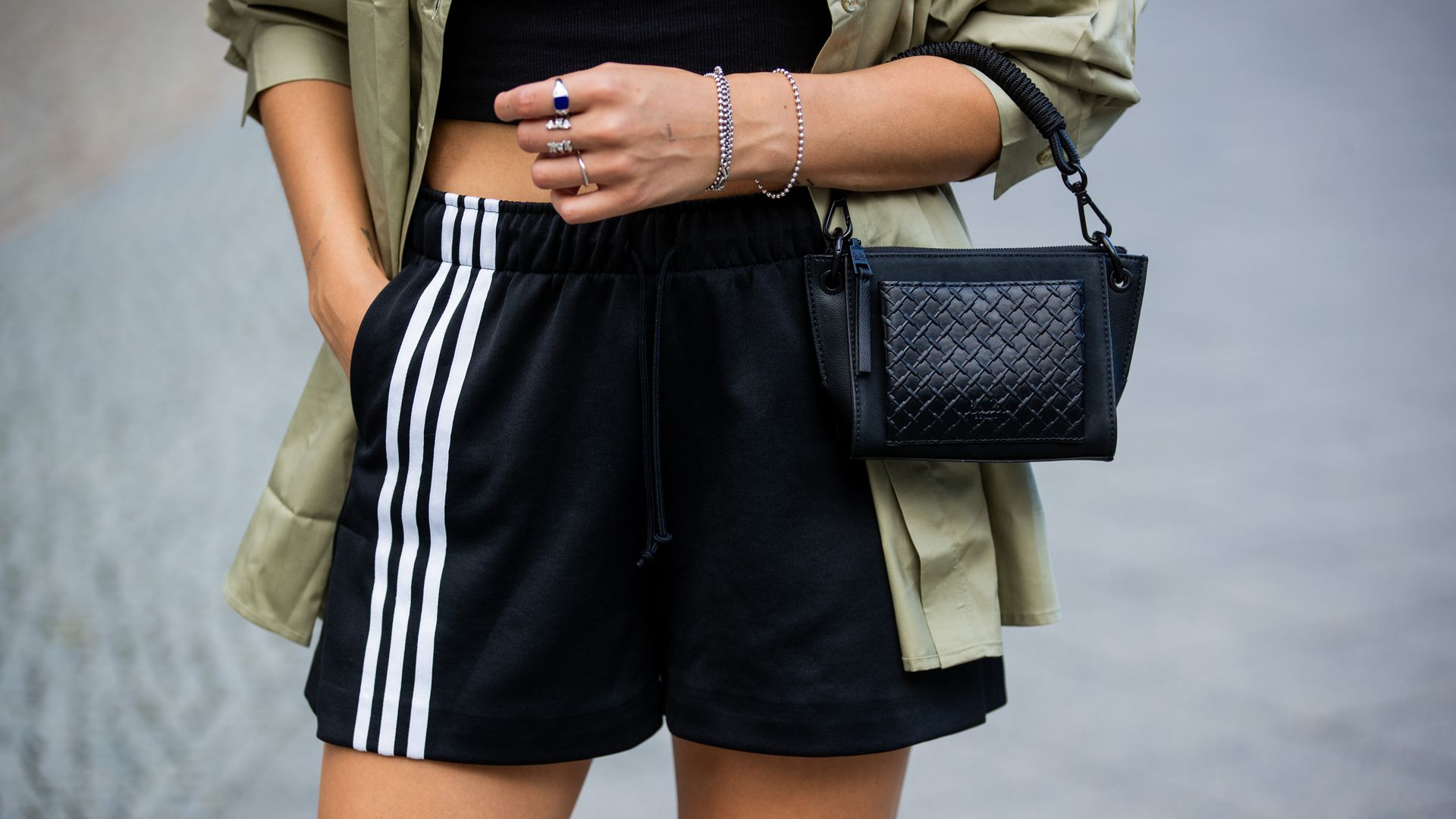 Jacqueline Zelwis is seen wearing Josefine HJ x Na-kd button shirt, cropped Zara Top, Adidas Shorts Lala Berlin bag, Havannas flip flop 