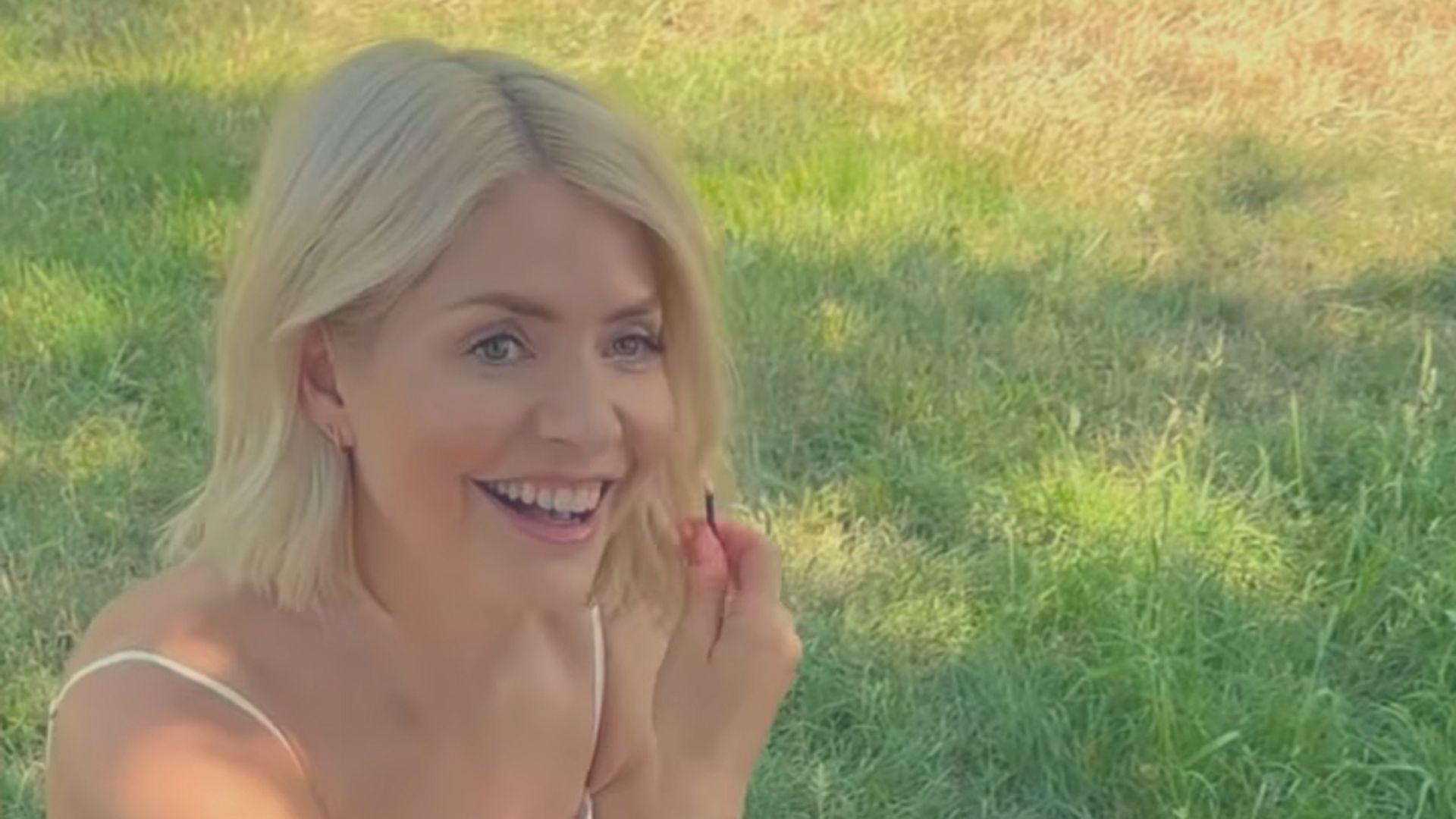 Holly Willoughby wearing a white summer dress. 