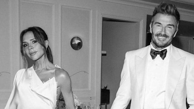 David and Victoria Beckham holding hands