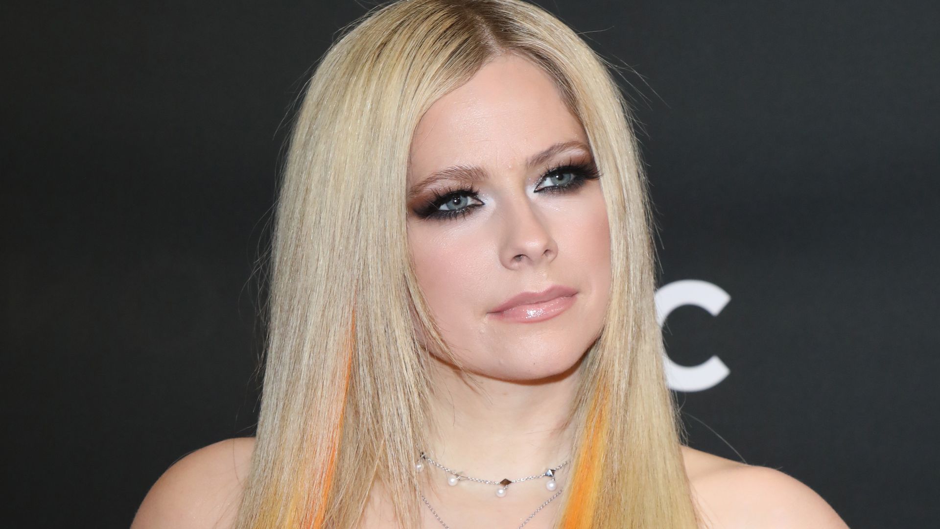 Avril Lavigne in a leather top with orange hair at the 2022 JUNO Awards Broadcast 