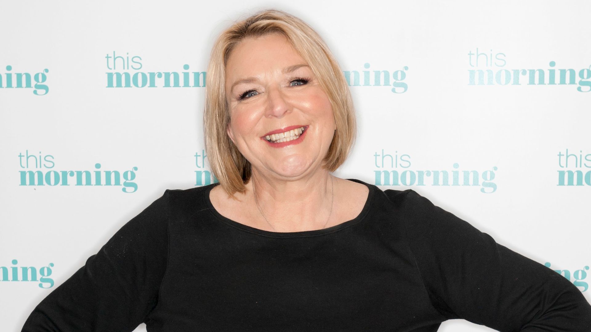 Fern Britton in black shirt and jeans