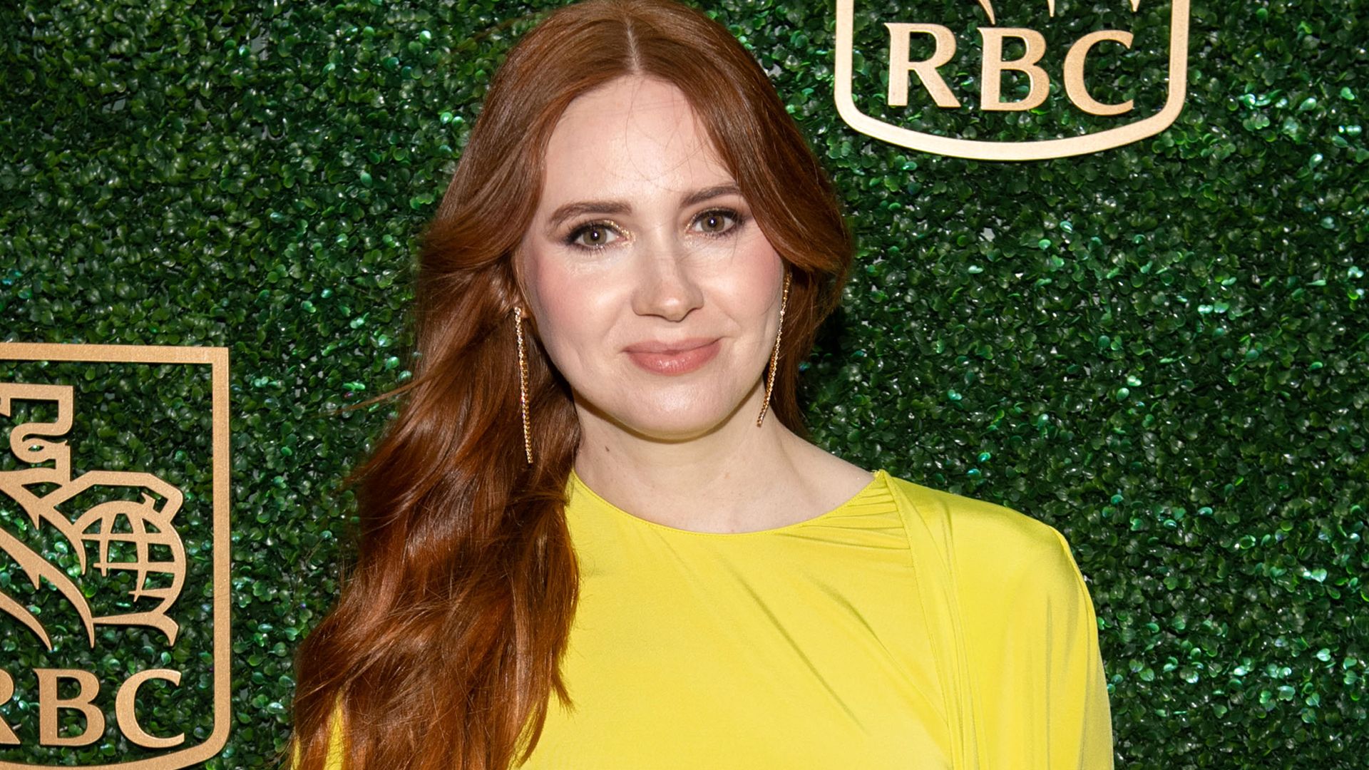 Karen Gillan hugging her baby bump