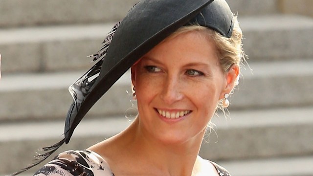 Duchess Sophie waving in a horse print black and white dress