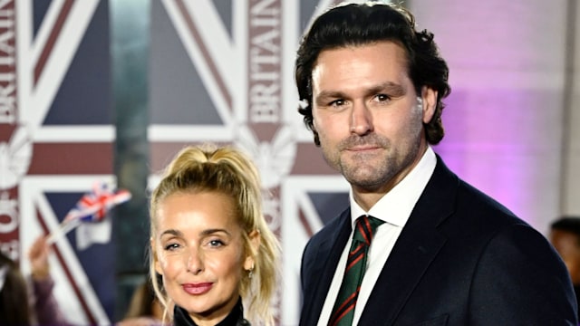 Louise Redknapp in black and Drew Michael on red carpet 