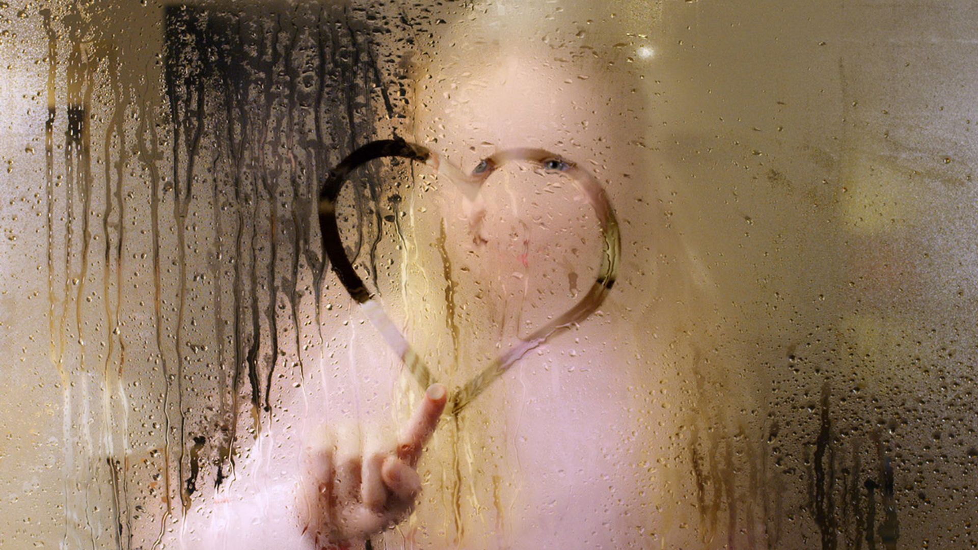 girl drawing window condensation