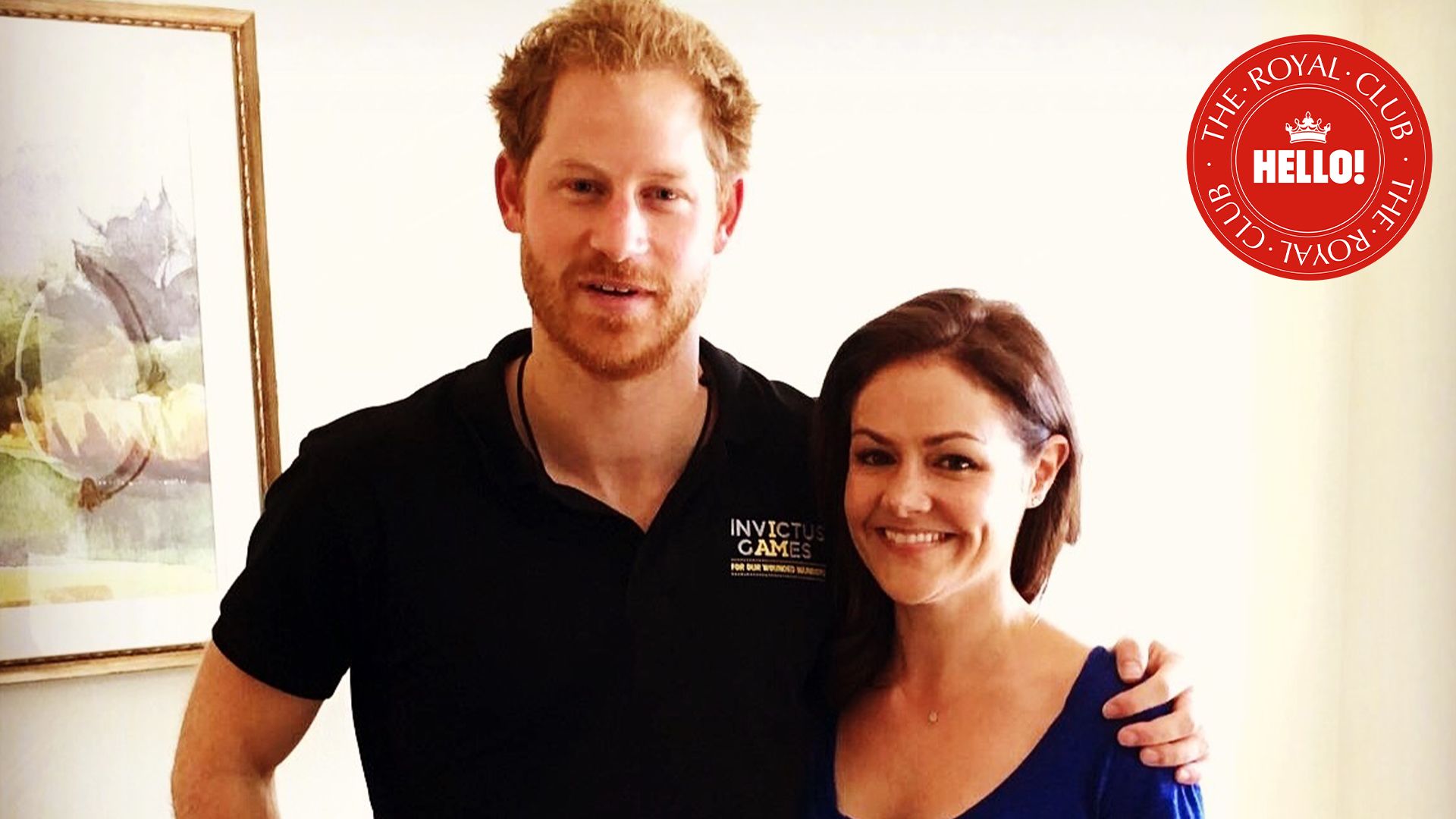 Prince Harry in blue polo shirt with arm round HELLO! Royal Editor Emily Nash