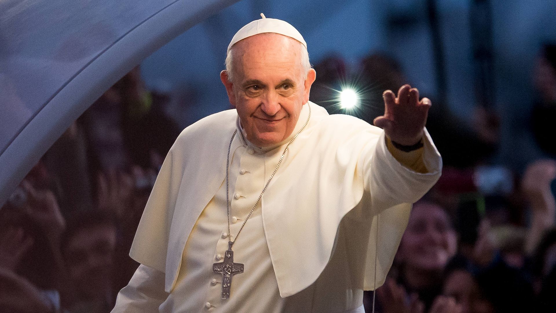 Pope Francis waves from the Popemobile on his way to attend the Via Crucis on Copacabana Beach during World Youth Day celebrations on July 26, 2013 in Rio de Janeiro, Brazil. More than 1.5 million pilgrims are expected to join the pontiff for his visit to the Catholic Church's World Youth Day celebrations which is running July 23-28