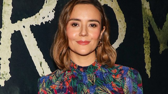 Catalina Sandino Moreno smiling for a red carpet photo