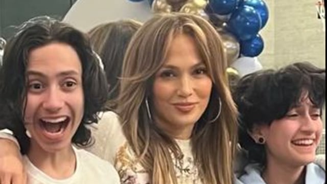 photo of jennifer lopez with twins max and emme standing behind birthday cake