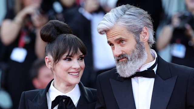 Winona Ryder and Scott Mackinlay Hahn attend a red carpet for the movie "Beetlejuice Beetlejuice" during the 81st Venice International Film Festival at  on August 28, 2024 in Venice, Italy.