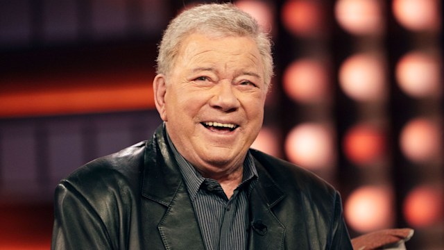 William Shatner wearing a leather jacket and black shirt while appearing on the Kelly Clarkson show for interview