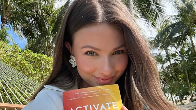Mimi relaxes with her book 