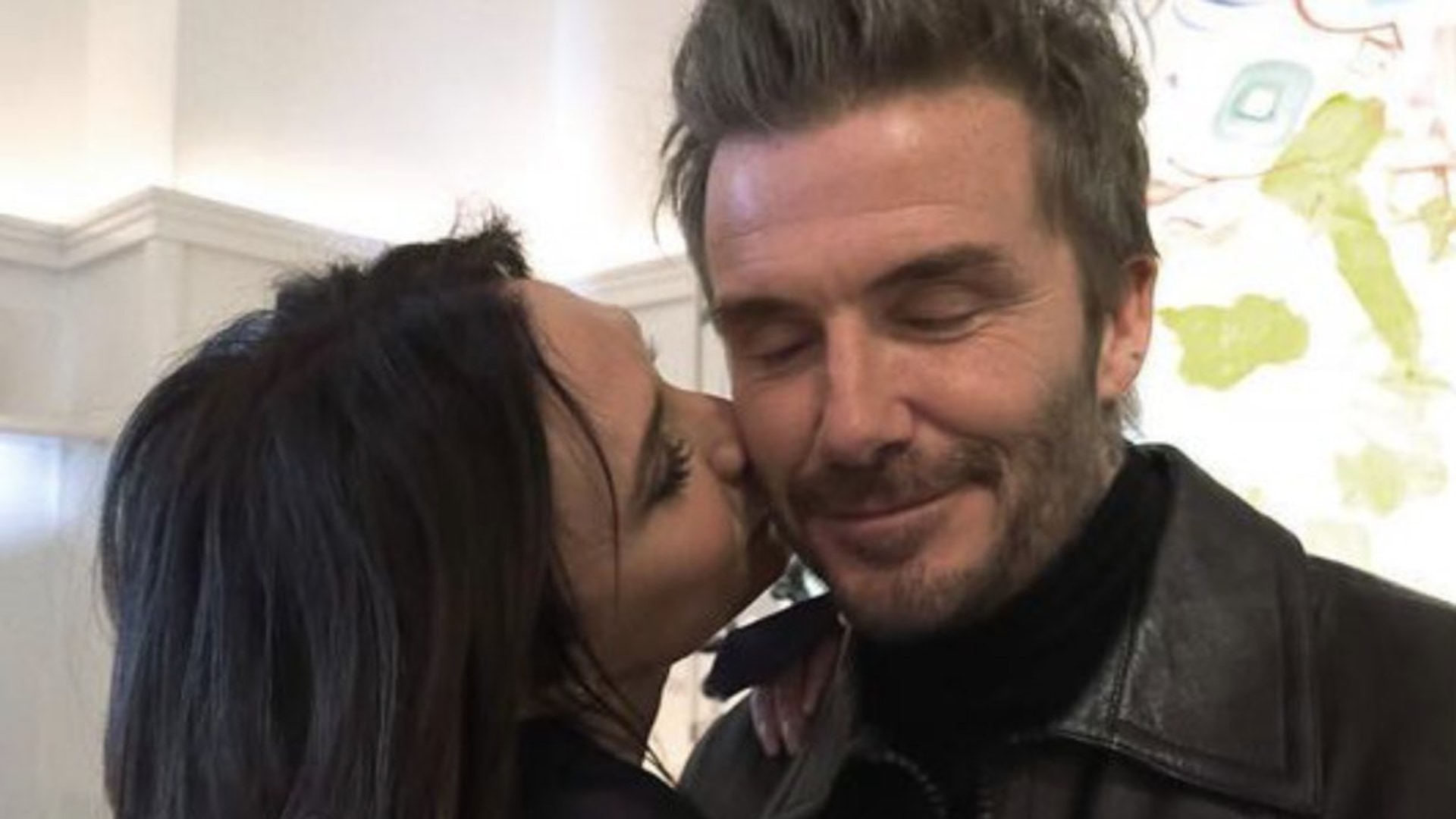 Victoria Beckham kissing David Beckham