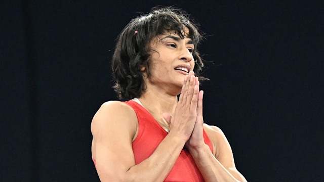 India's Vinesh Vinesh celebrates her win over Cuba's Yusneylis Guzman Lopez  in their women's freestyle 50kg wrestling semi-final match at the Champ-de-Mars Arena during the Paris 2024 Olympic Games, in Paris on August 6, 2024.