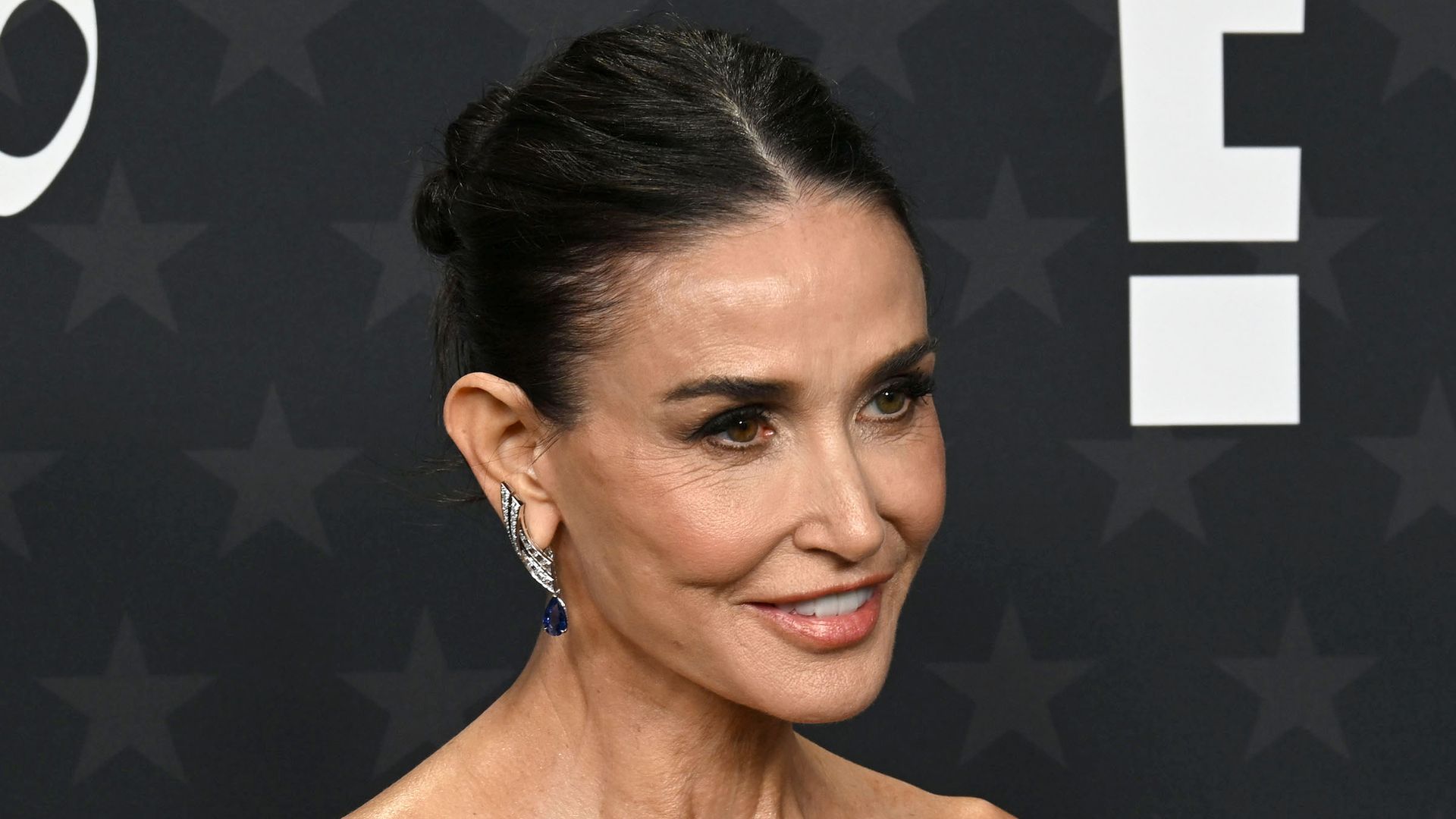 Demi Moore makes a statement in lace-up back dress as she celebrates big moment