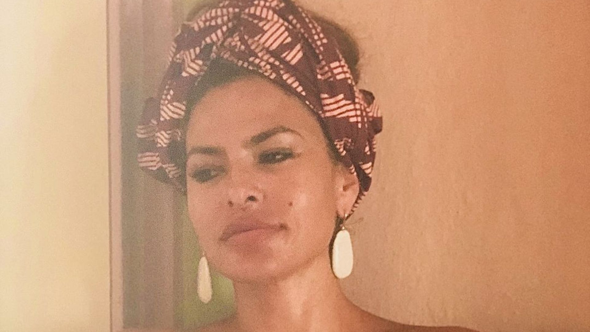 Eva Mendes stuns in strapless summer dress as she embraces the heat