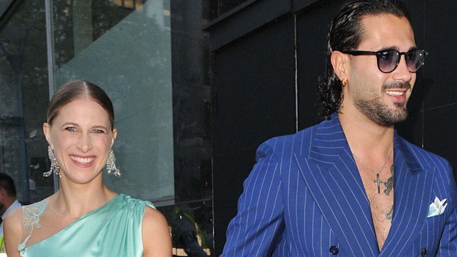 Giada Lini in a green satin dress with Graziano Di Prima in a blue striped suit