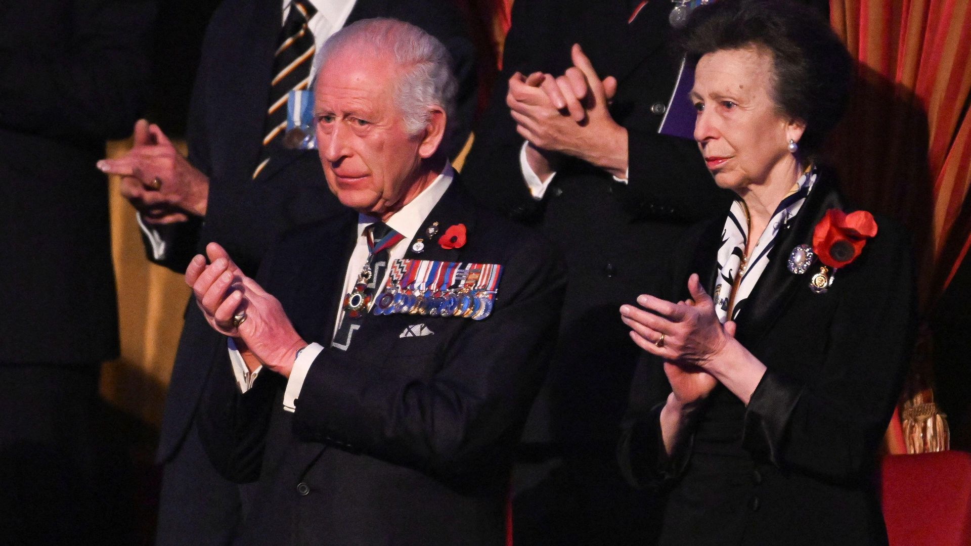 King Charles and Princess Anne clapping