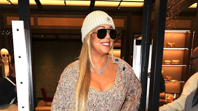 Mariah Carey was all smiles during a festive shopping trip in stunning style at the Gucci store in Aspen.

