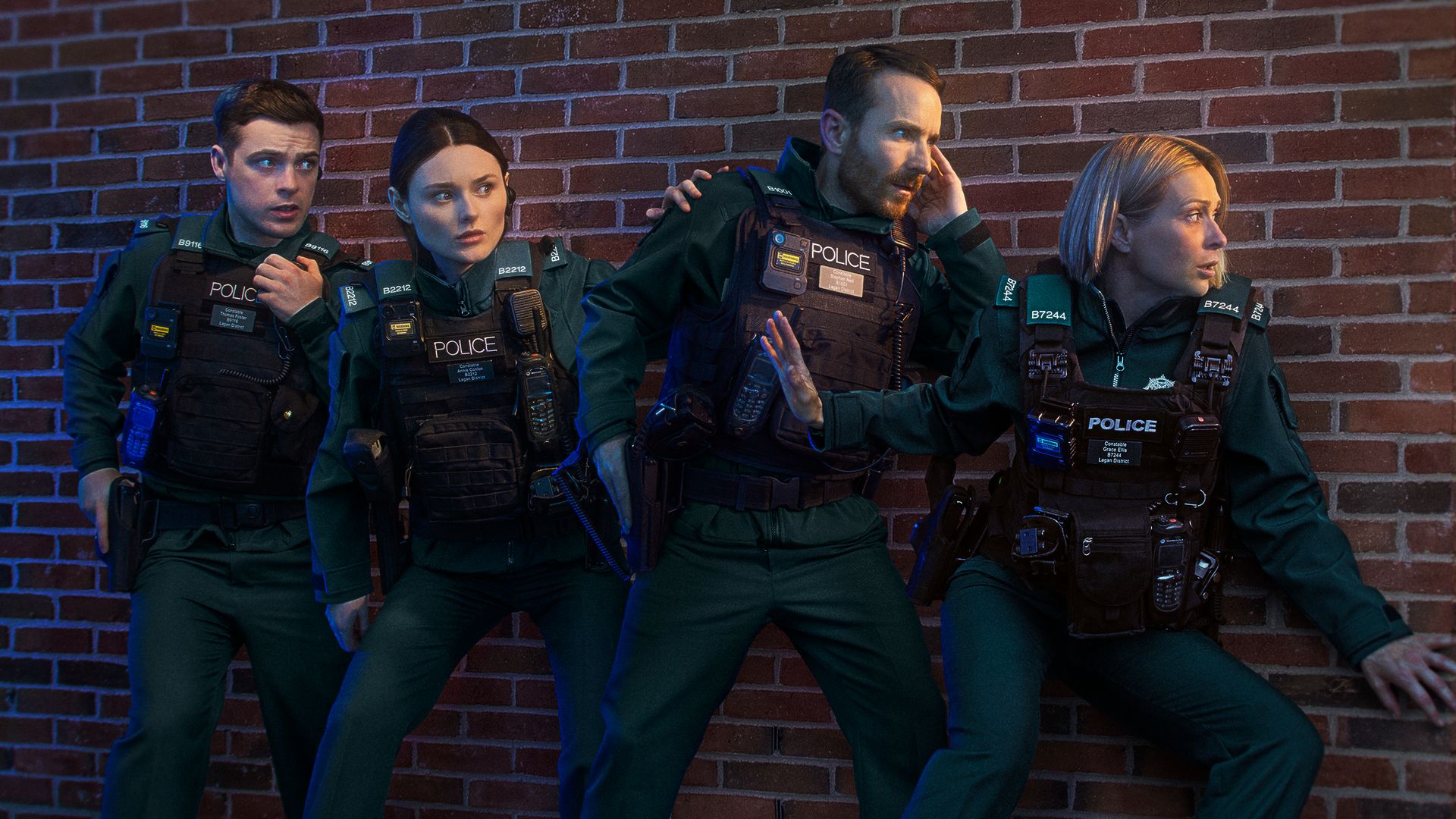 Four police officers in a line