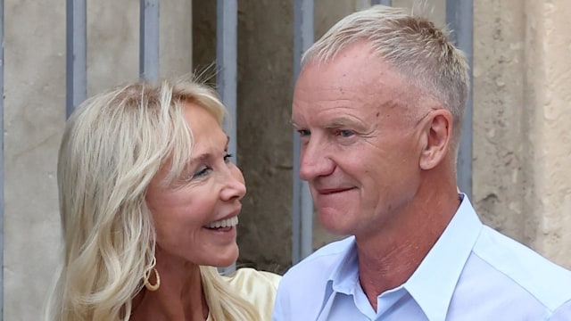trudie in yellow dress smiling at sting