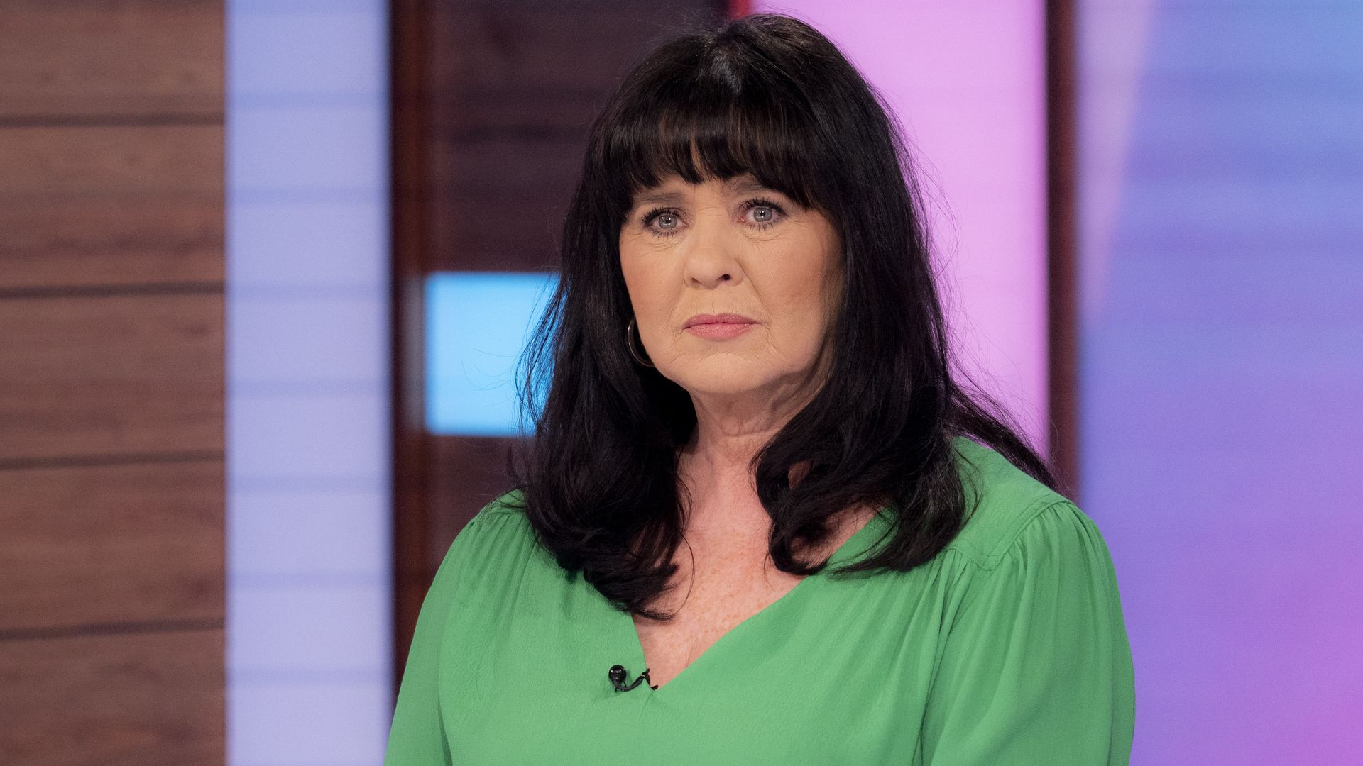 Coleen Nolan looking serious in a green top on Loose Women