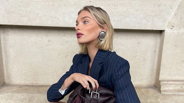 Elsa Hosk poses in a matching skirt and blazer combo and white heels on her Instagram