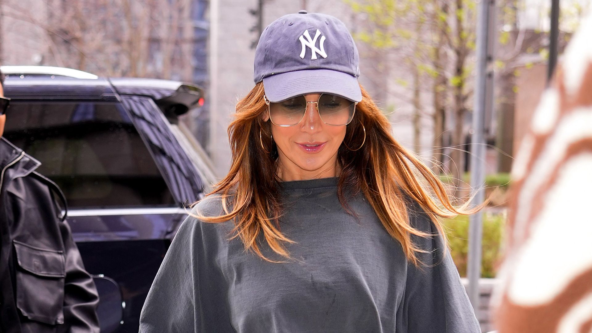 Jennifer Lopez wearing a baseball cap and crop top in New York.