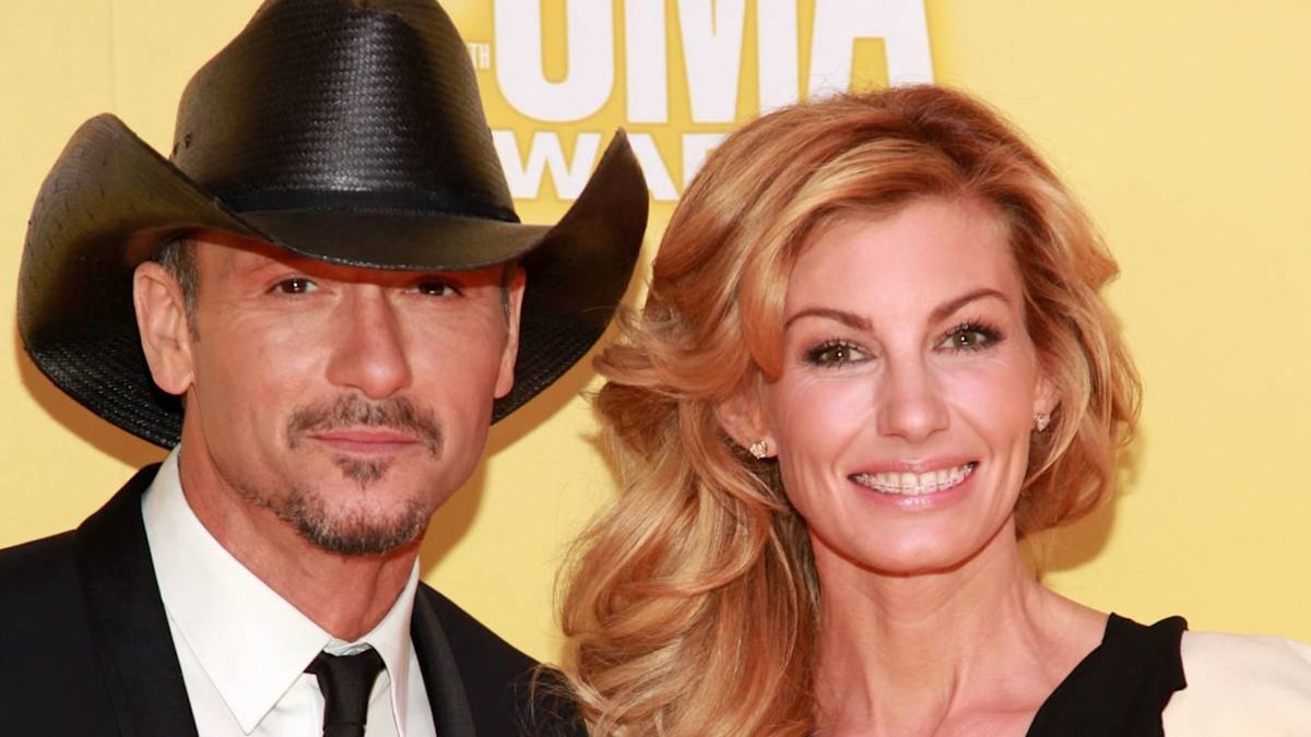 Tim McGraw's daughters sunbathe poolside together as family