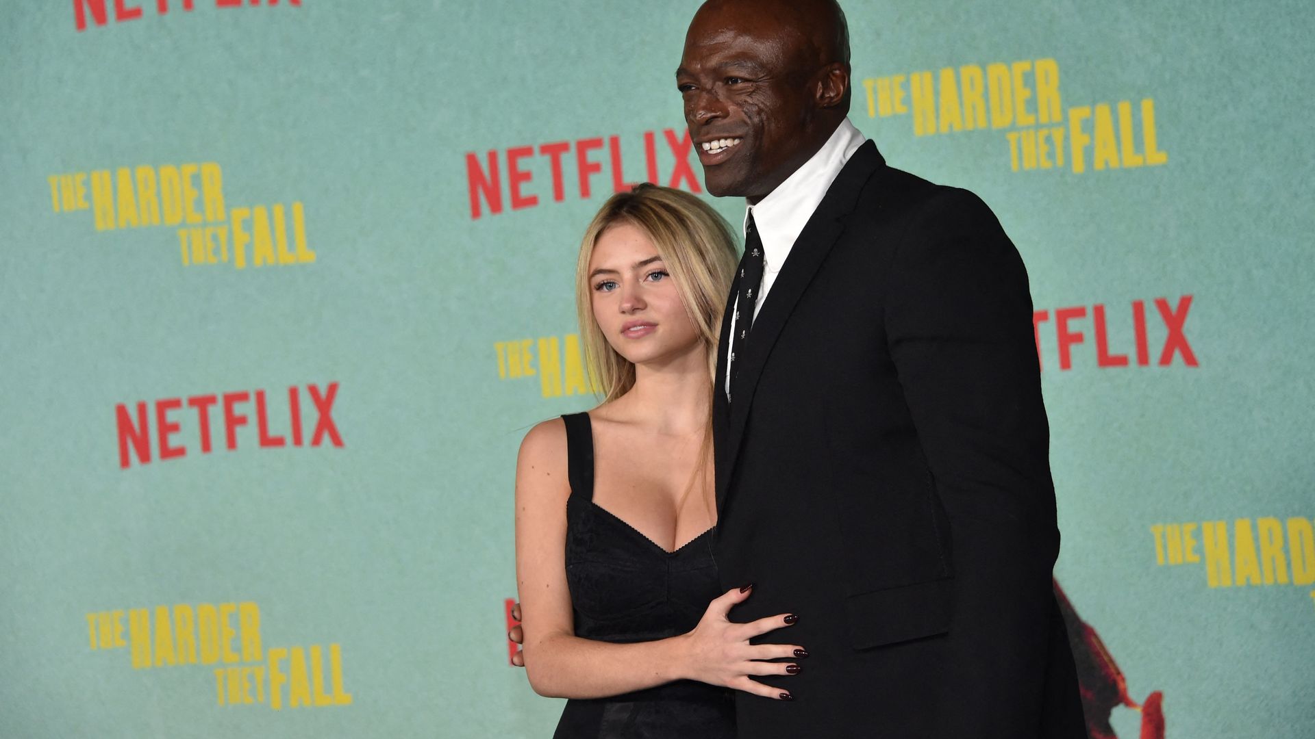 TOPSHOT - British singer Seal (R) and US model Leni Olumi Klum arrive for the Los Angeles Special Screening of Netflix's "The Harder They Fall" at the Shrine Auditorium in Los Angeles, October 13, 2021. (Photo by Chris DELMAS / AFP) (Photo by CHRIS DELMAS/AFP via Getty Images)