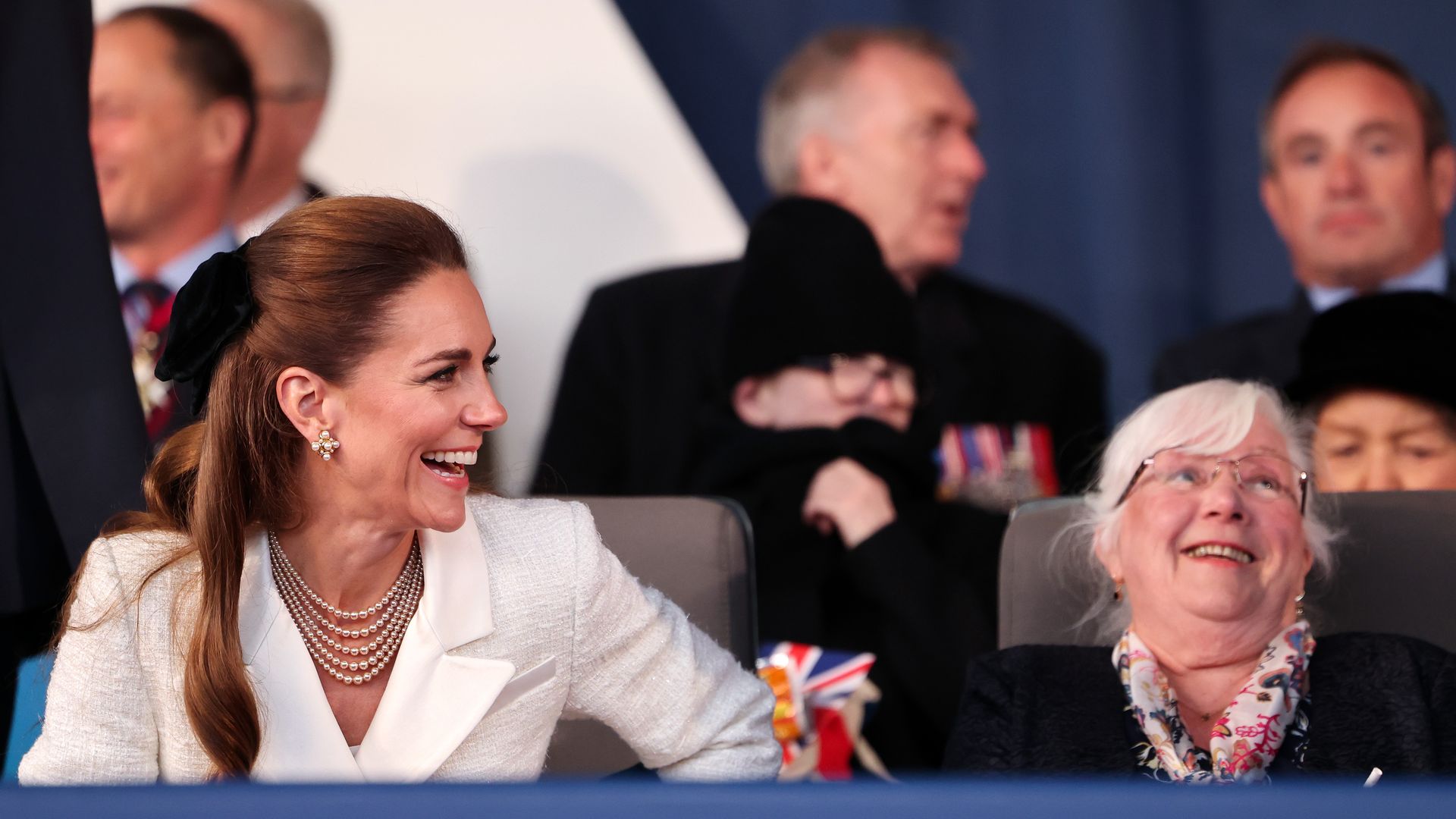 Kate Middleton laughing with an elderly lady