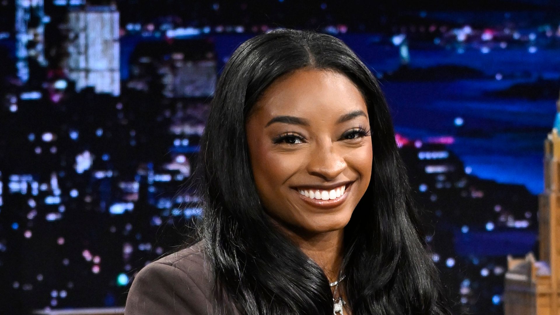 Simone Biles poses in stunning little black dress while looking back on time with husband Jonathan Owen