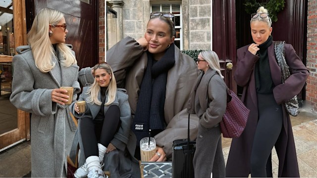 COLLAGE OF MOLLY MAE HAGUE: Image 1 (Left): Molly-Mae stands outside holding a latte, dressed in a grey belted wool coat with oversized lapels. Her sleek blonde hair and tortoiseshell sunglasses complete the polished look.  Image 2 (Bottom-Center): Sitting at a café table, Molly-Mae smiles in a grey coat, black leggings, and white sneakers while holding coffee. Her casual pose radiates cozy sophistication.  Image 3 (Top-Center): Molly-Mae sits wrapped in a padded brown bomber jacket and black scarf. She rests her chin on her hand, radiating warmth and comfort in the outdoor setting.  Image 4 (Right-Center): Molly-Mae stands in profile, wearing the padded brown bomber and loungewear set, paired with sunglasses and a burgundy tote, perfect for a travel-ready, chic aesthetic.  Image 5 (Far Right): Molly-Mae poses in a long burgundy coat over a black turtleneck and leggings. Her woven bag and sleek bun complement the look's understated elegance.