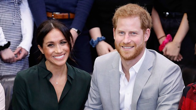 Harry and Meghan smiling in Sussex