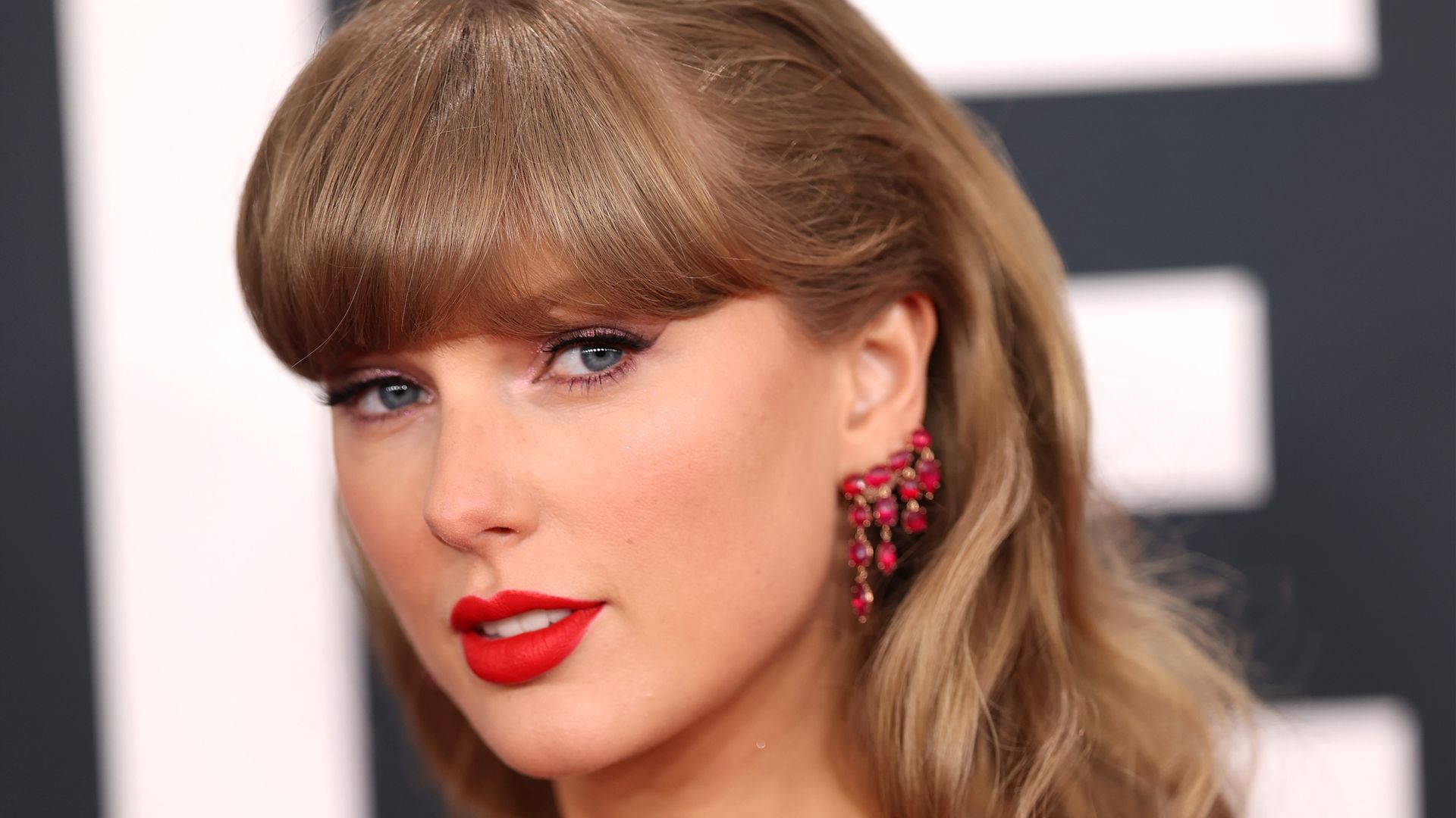 Taylor Swift dazzles in red-hot mini-dress at the Grammys — & her possible nod to Travis Kelce is unmissable