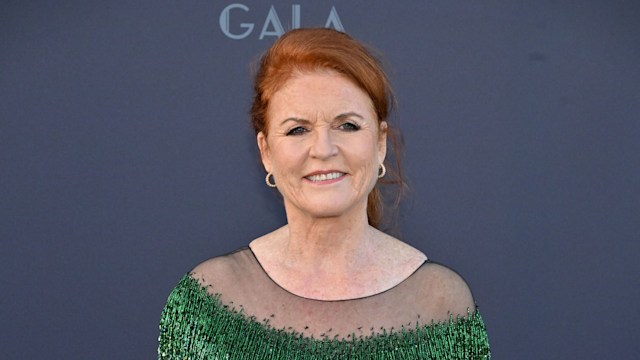 Sarah Ferguson smiling in glitzy green dress