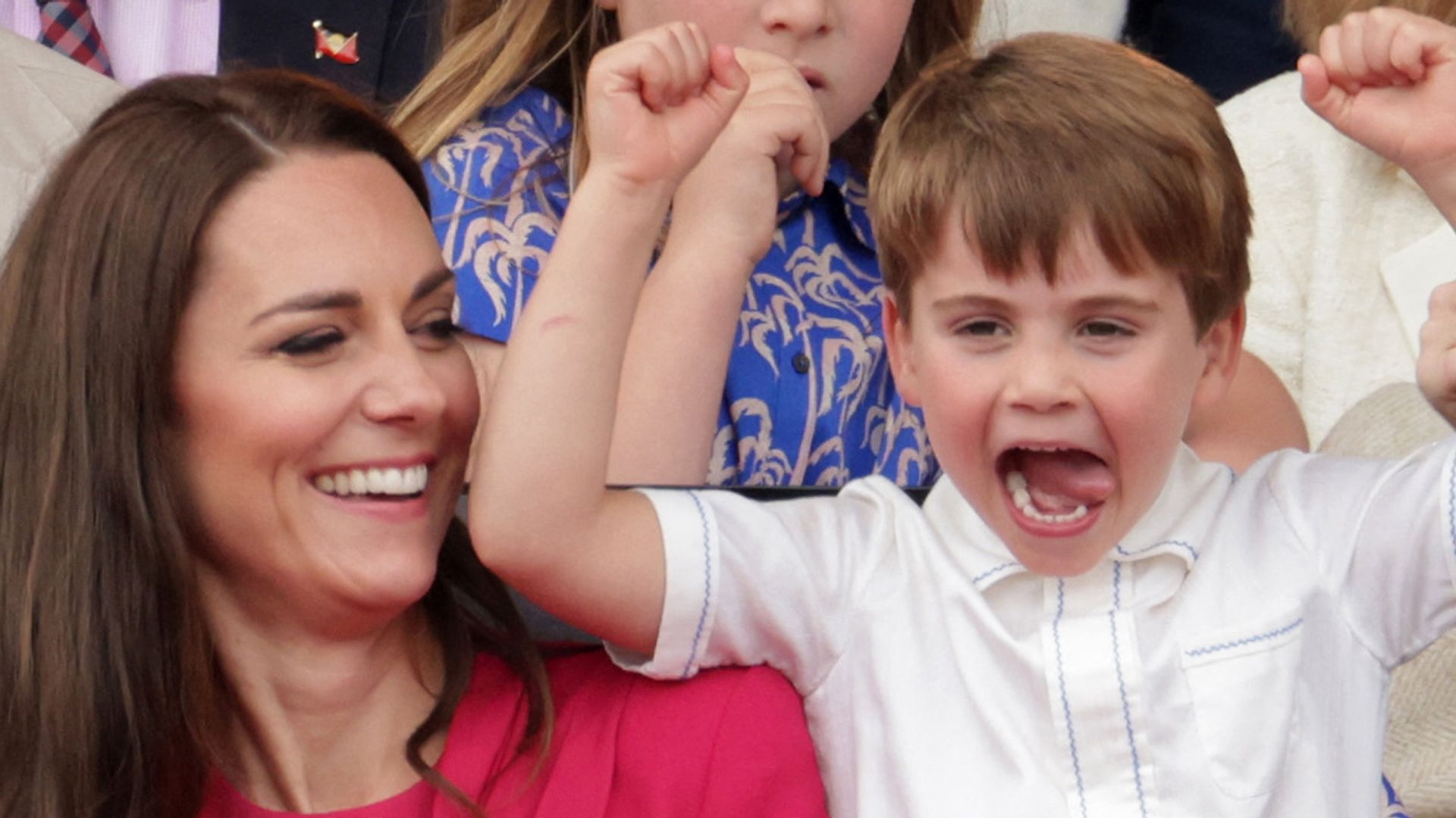 Kate laughing at louis with hands in air