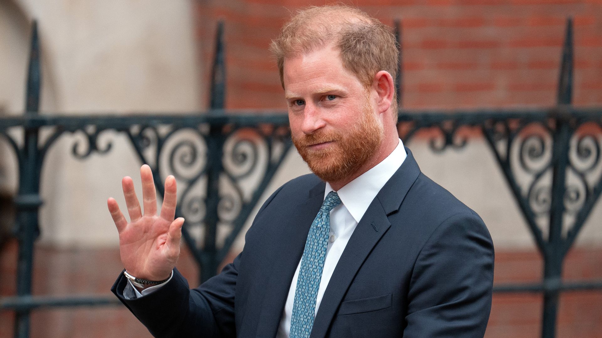 Prince Harry waving in suit