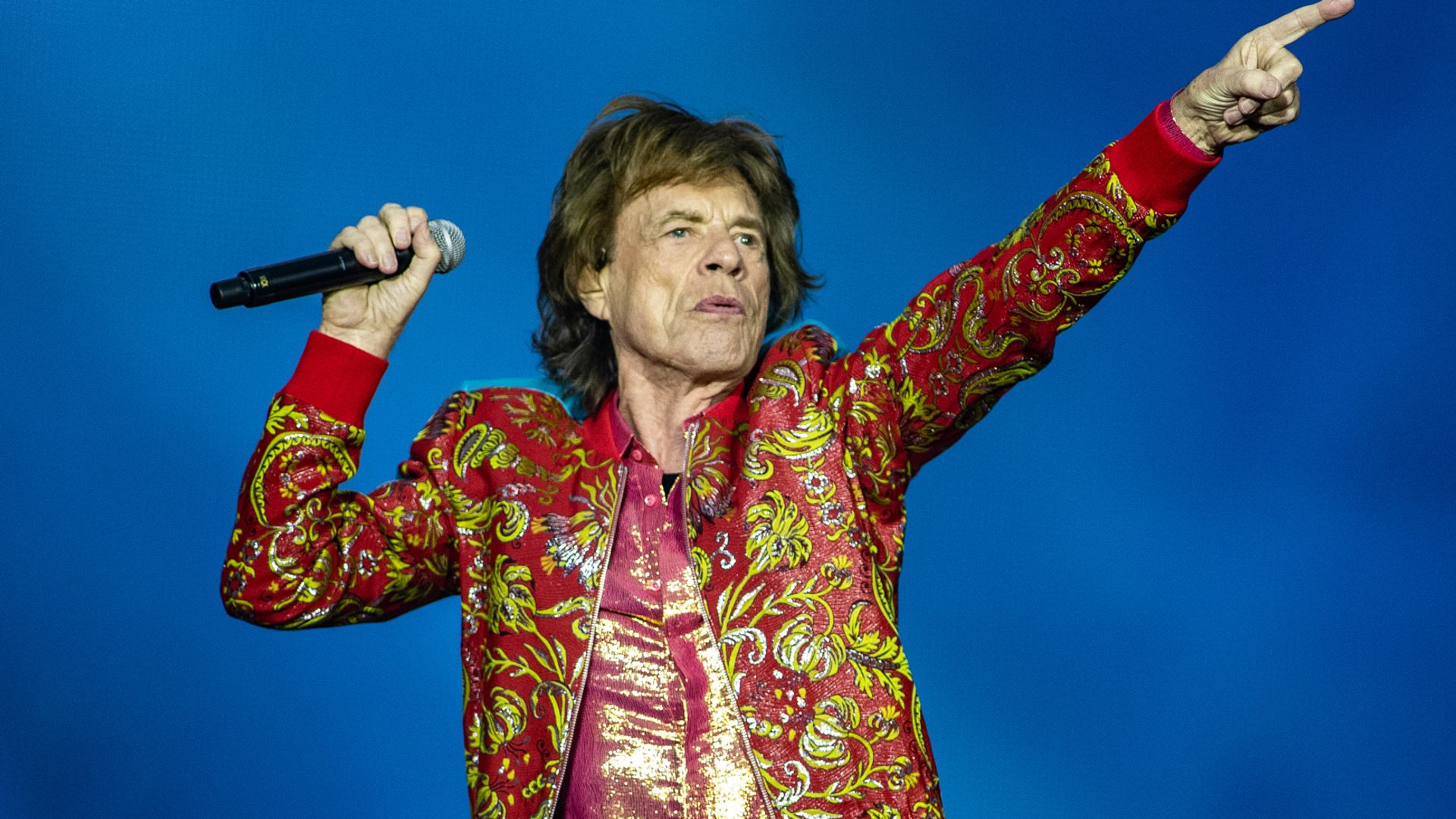 Mick Jagger on stage performing