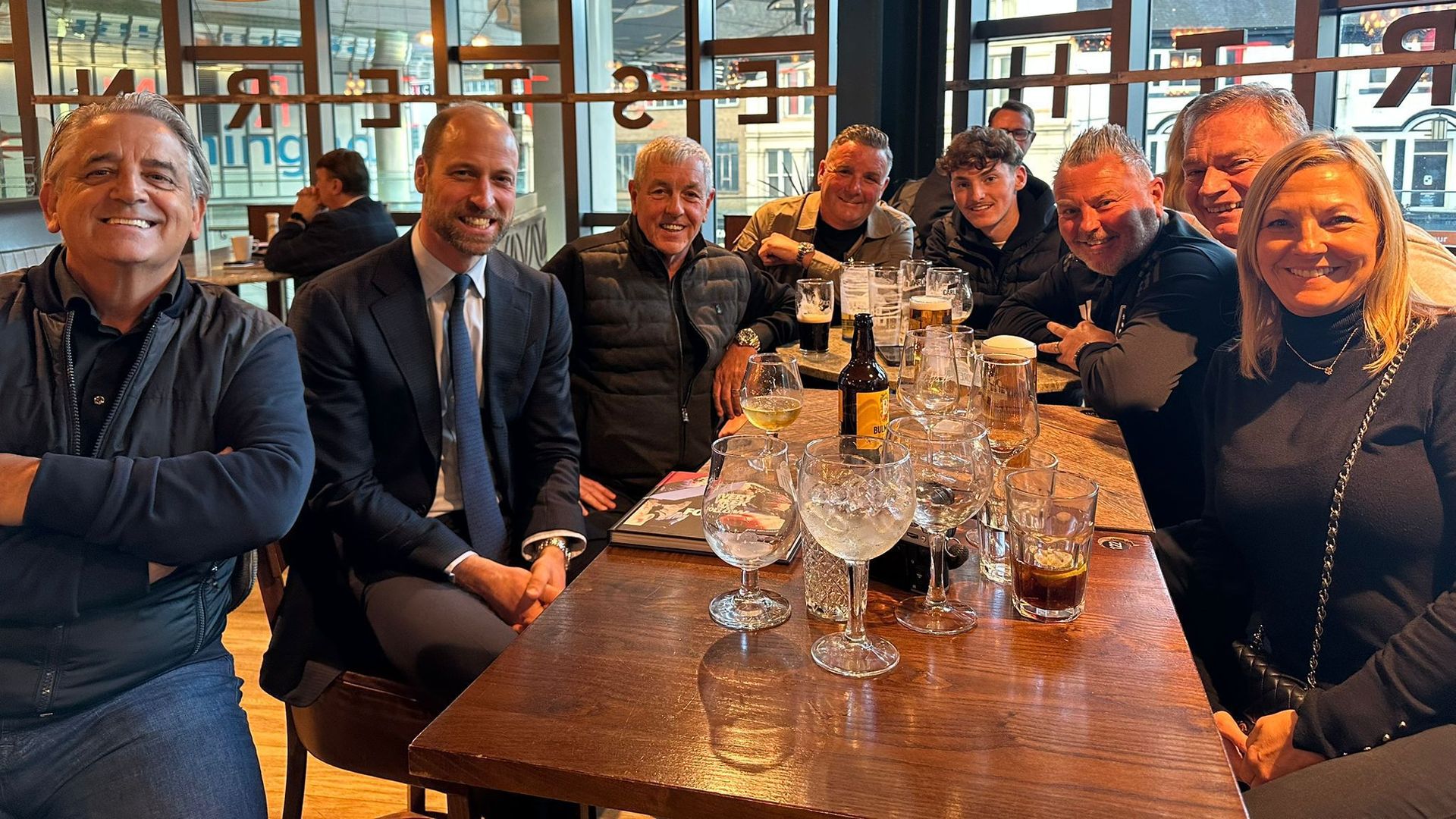 Prince William with football fans at the Wetherspoons at New Street Station in Birmingham