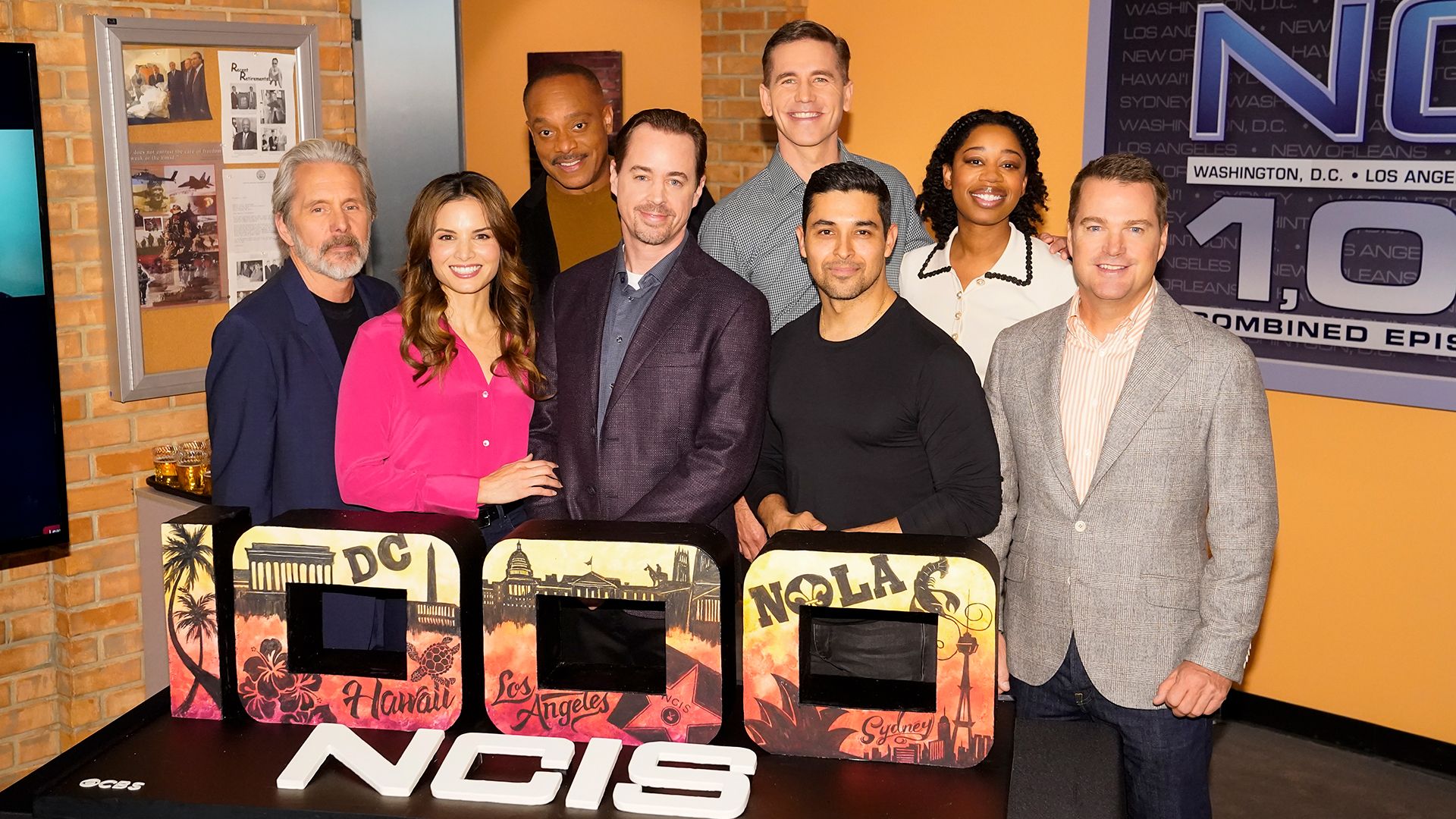 Gary Cole, Katrina Law, Rocky Carroll, Sean Murray, Brian Dietzen, Wilmer Valderrama, Diona Reasonover, and Chris O'Donnell celebrate NCIS 1000th episode. 