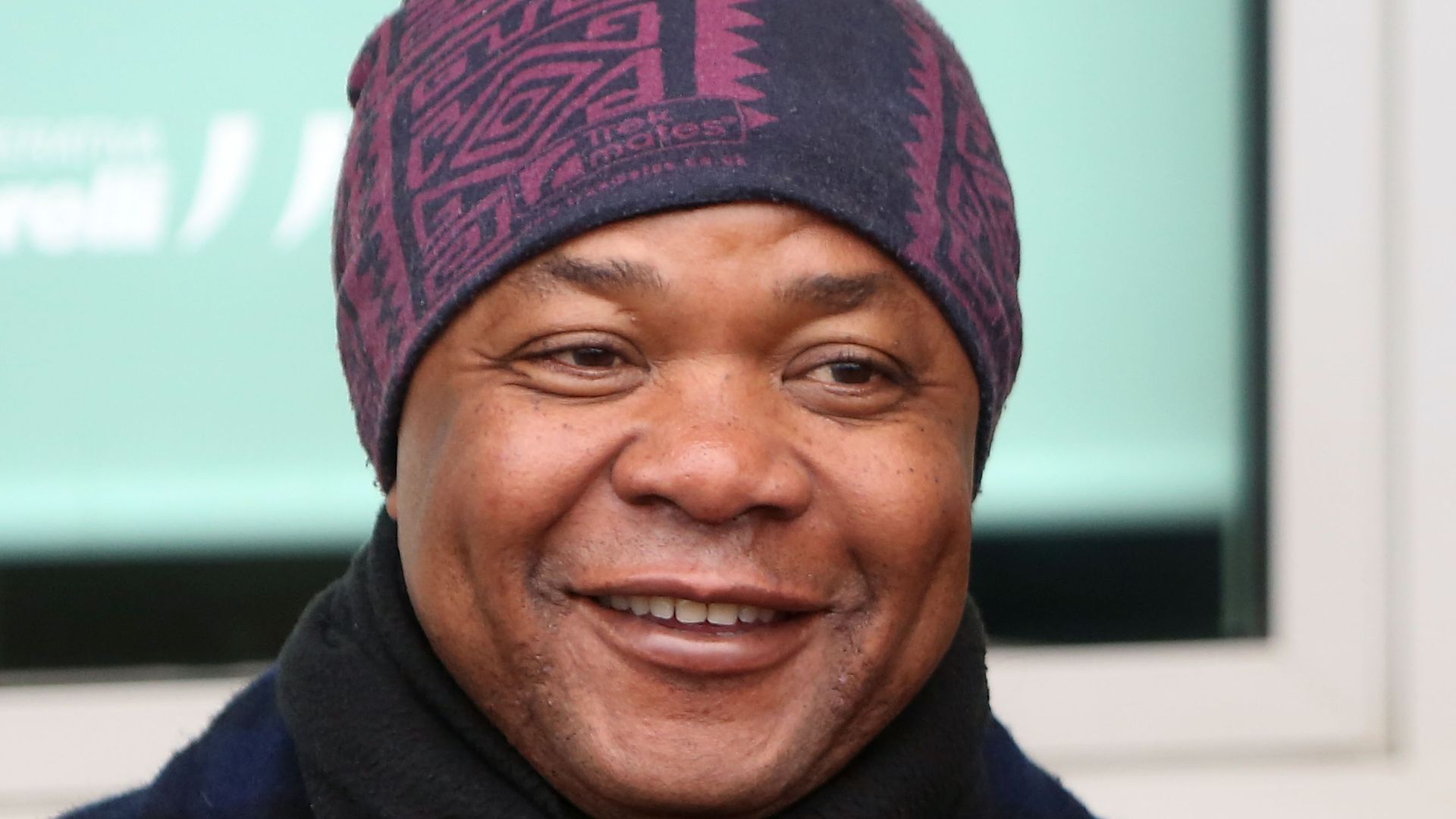 Patrick Lumumba speaking to media outside a courthouse