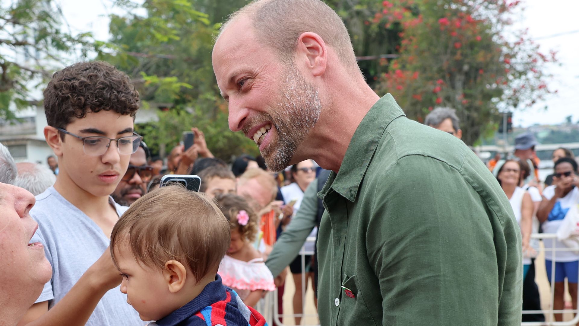 Prince William meets baby in Brazil