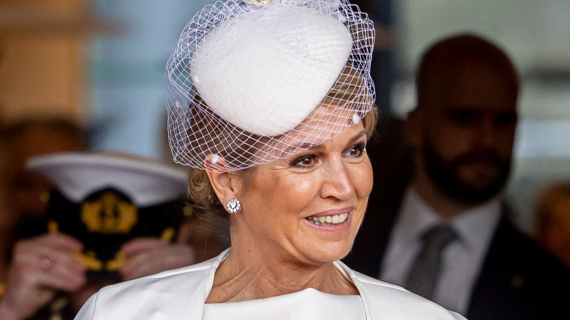 Queen Maxima's bridal white cape dress is a masterclass in styling monochrome in your 50s